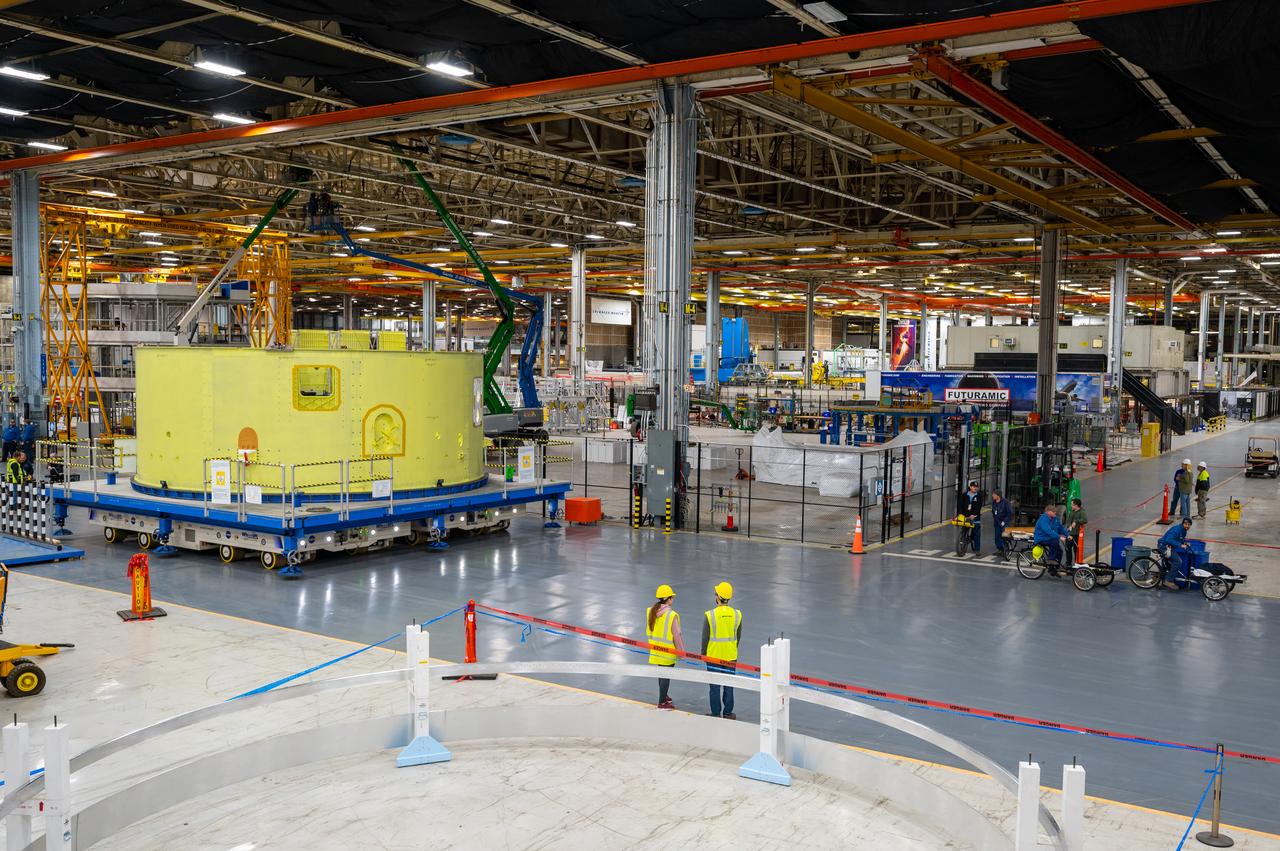 Crews at NASA’s Michoud Assembly Facility in New Orleans move the forward skirt of NASA’s Space Launch System (SLS) rocket to another part of the facility Dec. 15. Teams are preparing to apply the thermal protection system to the flight hardware, which will protect it from the extreme temperatures during launch and flight. The forward skirt is part of the core stage that will power the SLS rocket for the Artemis III mission. The forward skirt houses flight computers, cameras, and avionics.. The SLS core stage is made up of five unique elements: the forward skirt, liquid oxygen tank, intertank, liquid hydrogen tank, and the engine section. When fully stacked, the forward skirt is located at the top of the core stage and connects the stage to the upper part of the rocket. Together with its four RS-25 engines, the rocket’s massive 212-foot-tall core stage — the largest stage NASA has ever built — and its twin solid rocket boosters produce 8.8 million pounds of thrust to send NASA’s Orion spacecraft, astronauts and supplies beyond Earth’s orbit to the Moon and, ultimately, Mars. Offering more payload mass, volume capability and energy to speed missions through space, the SLS rocket, along with NASA’s Gateway in lunar orbit, the Human Landing System, and Orion spacecraft, is part of NASA’s backbone for deep space exploration and the Artemis lunar program. No other rocket is capable of carrying astronauts in Orion around the Moon in a single mission.